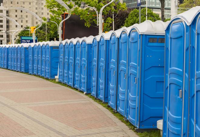 a line of portable restrooms set up for a wedding or special event, ensuring guests have access to comfortable and clean facilities throughout the duration of the celebration in Bell CA